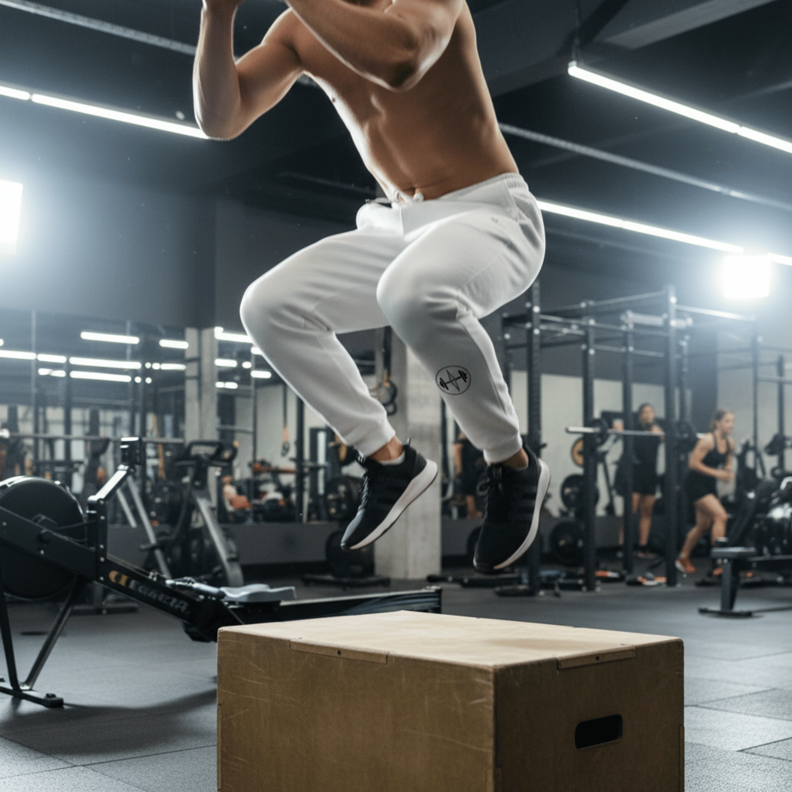 Person performing a box jump in a gym setting