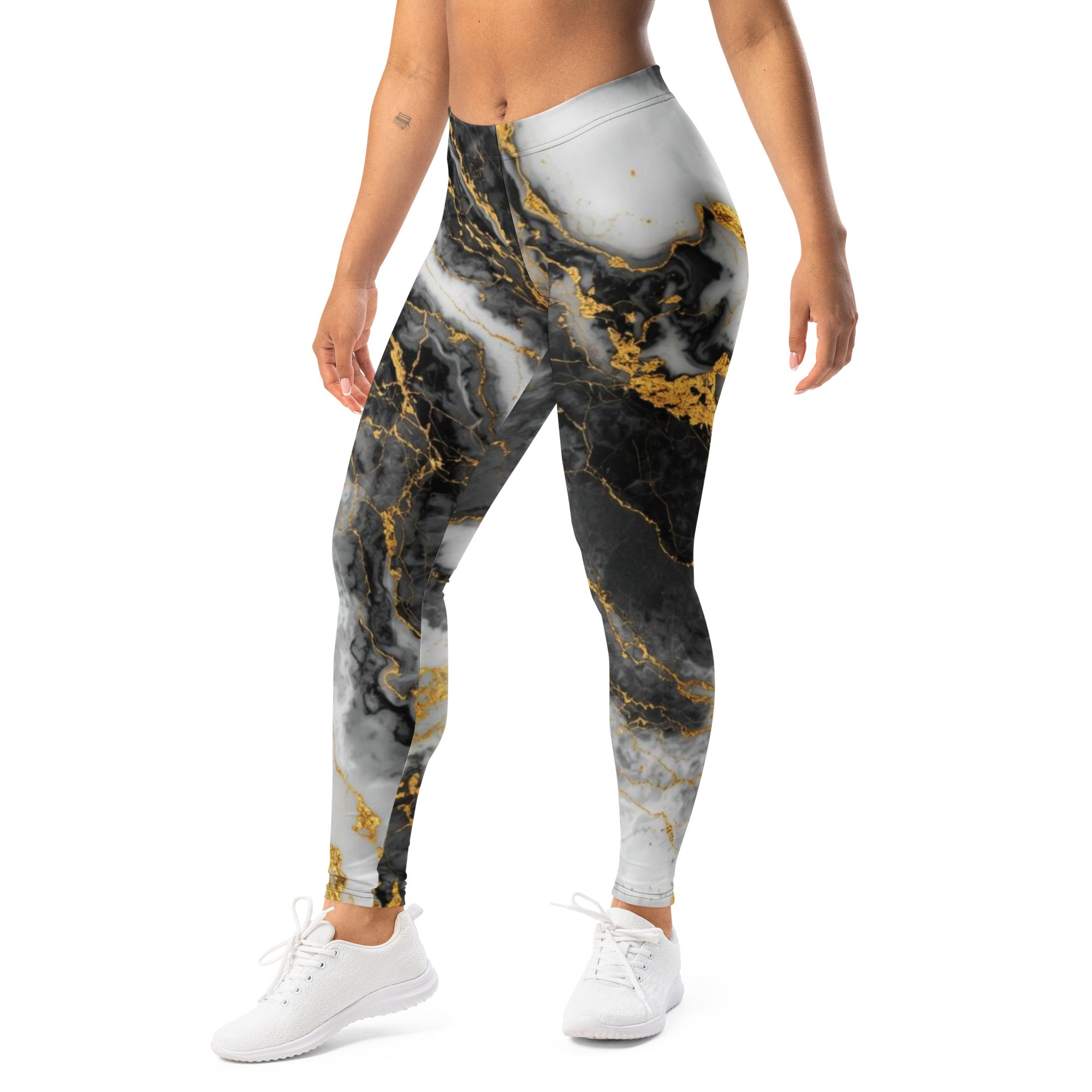 Marble-patterned leggings with gold accents worn by a person on a white background