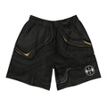 Black athletic shorts with gold accents and a logo on a white background