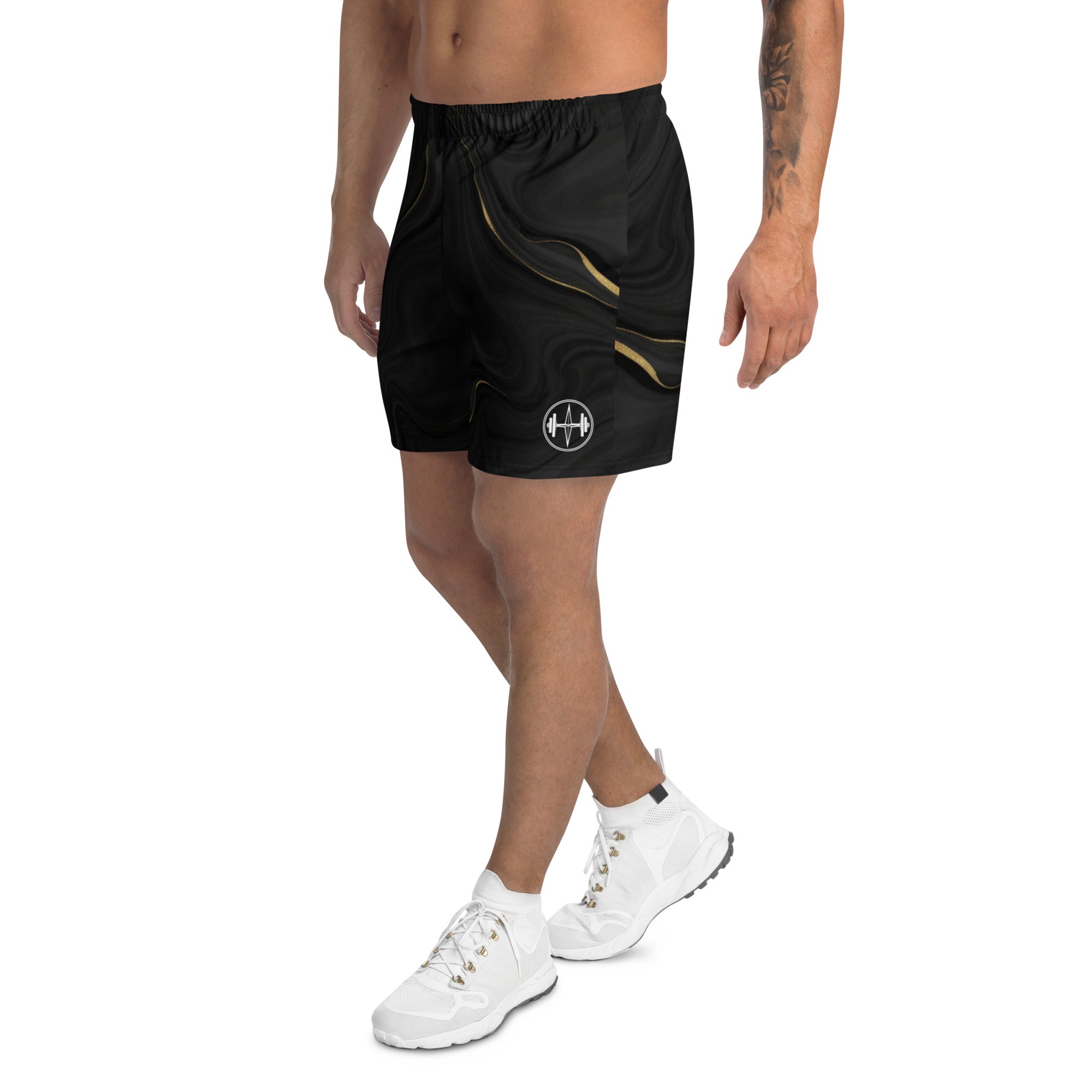 Person wearing black athletic shorts with a logo on a white background