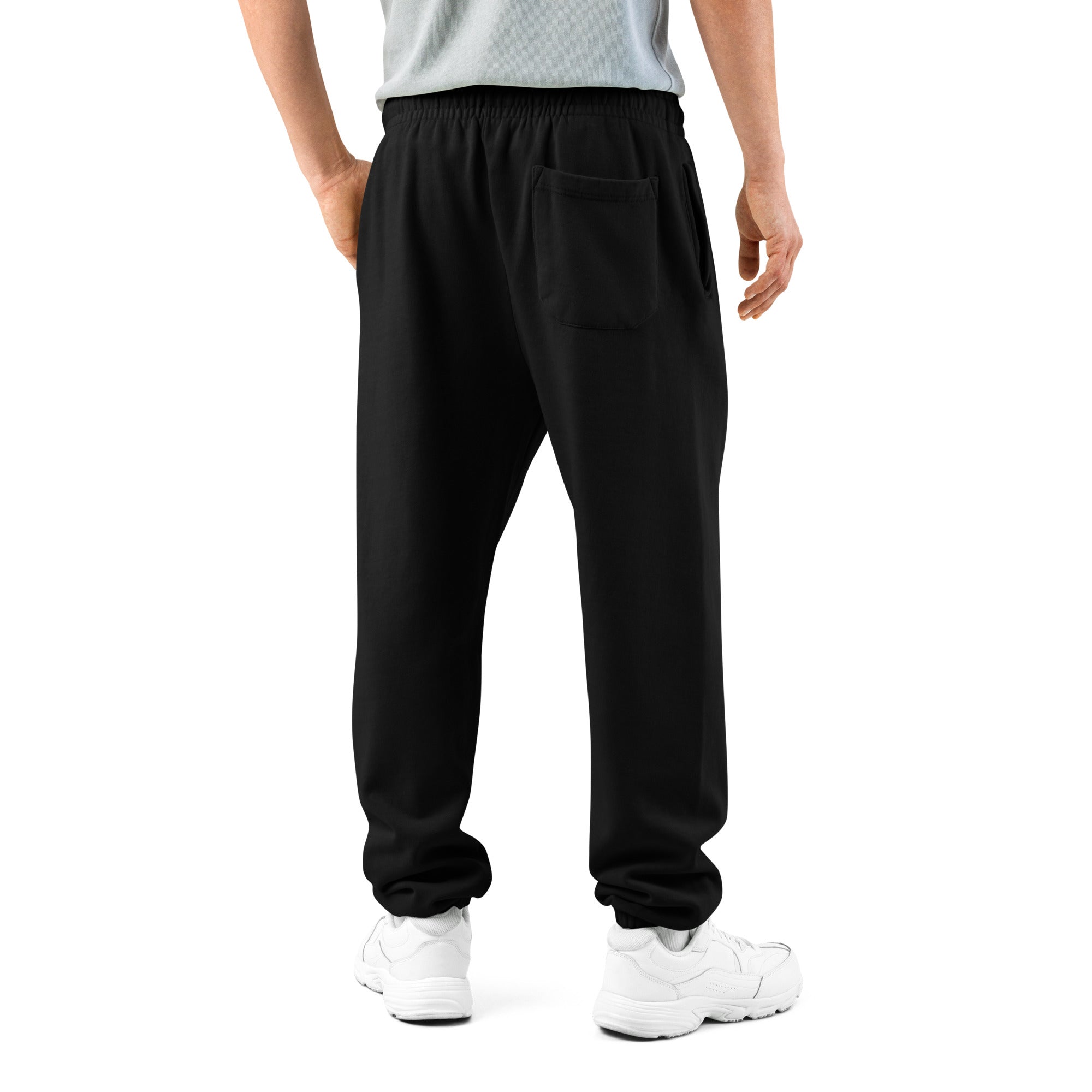 Person wearing black sweatpants on a white background
