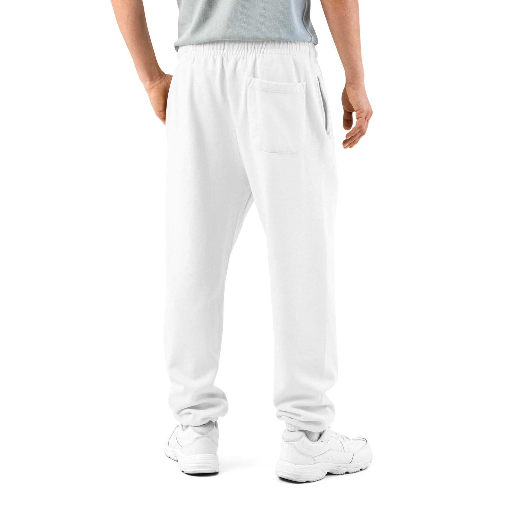 Person wearing white pants on a white background